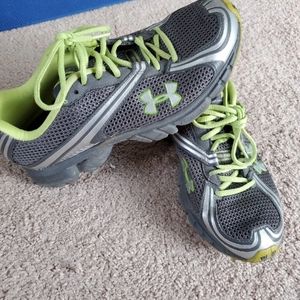 Gray and green under armour running shoes